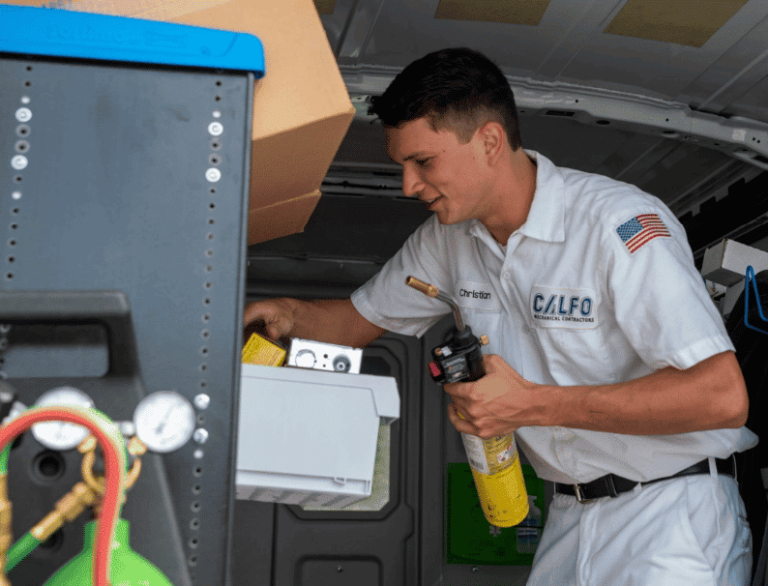 calfo employee preparing for a call in company vehicle