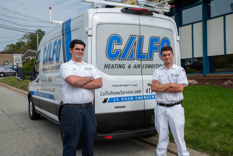 calfo staff standing with company van